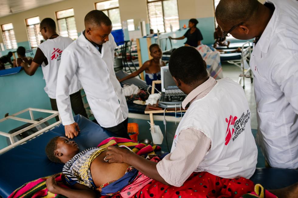 MSF staff examining Lita in the female ward at Nsanje District Hospital.
