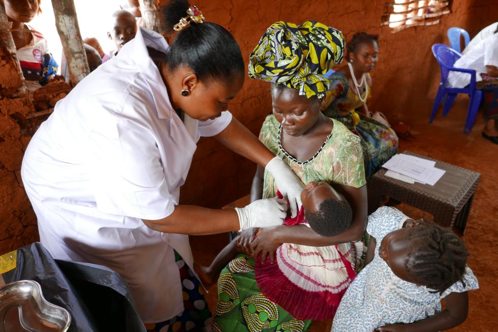 A small child receives a measles vaccination in Cecca 16 health center Wamba